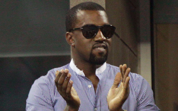 Singer Kanye West applauds at the U.S. Open tennis tournament in New York. (AP)