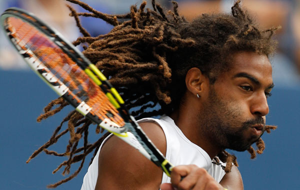 Dustin Brown of Jamaica returns the ball to Andy Murray of Britain at the U.S. Open tennis tournament in New York. (AP)