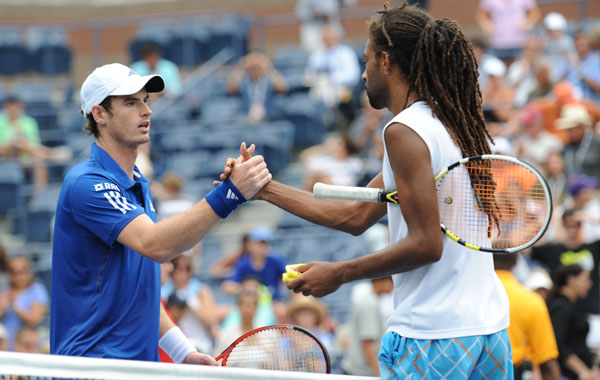 Andy Murray (L) of Britain shakes hands with Dustin Brown (R) of Jamaica after Murray won, 7-5, 6-3, 6-0, at the US Open 2010 tennis tournament in New York. (AFP)