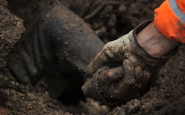 A rescuer holds the arm of the body of a person buried by a landslide in the Nahuala municipality, Solola, west of Guatemala City. Some 20 bodies have been retrieved in that place so far and there are still scores of missing people. The death toll from landslides in Guatemala rose to 36 on Sunday as the country's President Alvaro Colom declared the disaster a "national tragedy. (AFP)