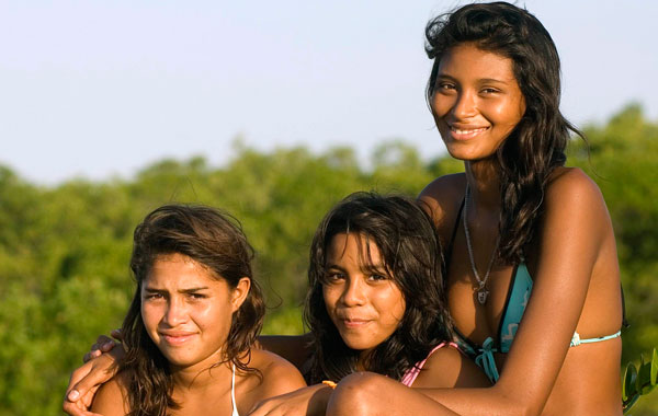 Fourteen-year-old Elisany Silva (R), who measures 2.06 meters (6'9") tall, poses for a picture with her sisters Talicia (L) and Eliza in Braganca in the Brazilian Amazon state of Para. (REUTERS)