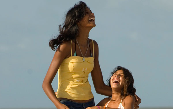 Fourteen-year-old Elisany Silva, who measures 2.06 meters (6'9") tall plays with her sister Talicia, 12, on Ajuruteua beach in Braganca in the Brazilian Amazon state of Para. (REUTERS)