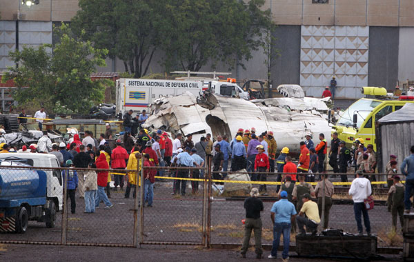 View of the wrecked fuselage of the Conviasa Airline plane en route to the resort city of Isla Margarita that went down about six miles (10 kilometers) from Puerto Ordaz, Venezuela carrying 51 people on board, in Puerto Ordaz, Bolivar state, Venezuela. (AFP)