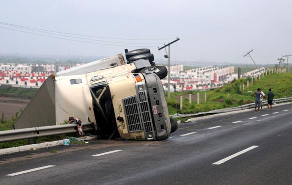 A truck lies overturned on the edge of a highway in the aftermath of Hurricane Karl in Chachalacas. (REUTERS)
