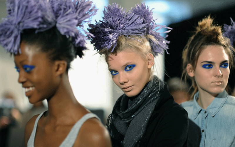 Models prepare backstage prior to the Louise Grey Spring/Summer 2011 show as part of London Fashion Week. (GETTY IMAGES)