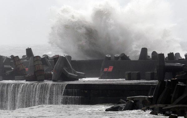 A big wave smashes into a breakwater as Typhoon Fanapi hits the northeastern coastal town of Nanfangao in Ilan county. (AFP)