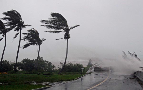 High Winds pushes water over the closed causeway leading to Wade International Airport as Hurricane Igor moves ashore in Bermuda. (AP)