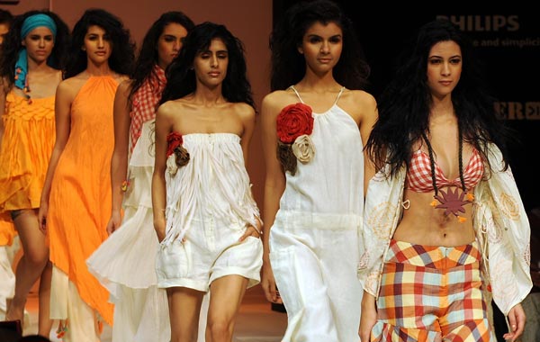 Models wearing creations by Indian designer Asmita Marwah walk the ramp on the first day of Lakme Fashion Week (LFW) Winter/Festive 2010 in Mumbai. (AFP)