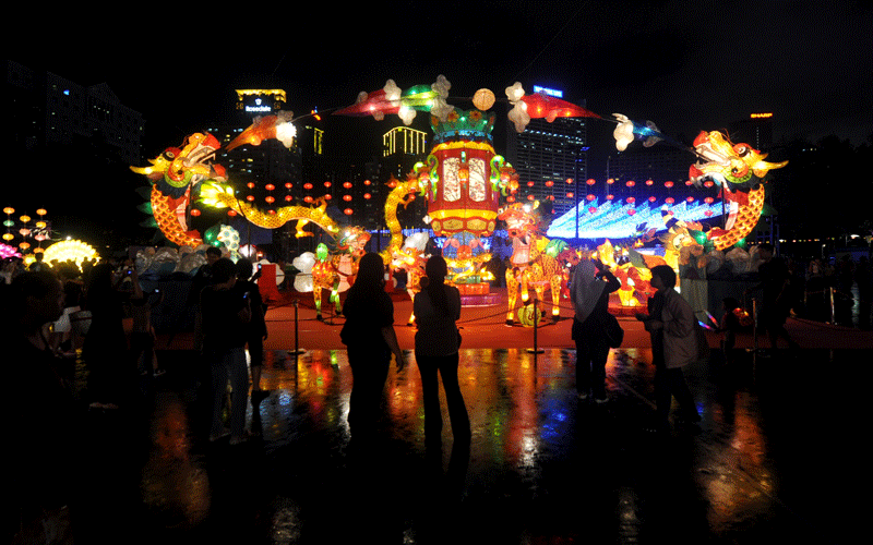 People look at giant lanterns displayed as part of mid-autumn festival celebration at a park in Hong Kong. (AFP)