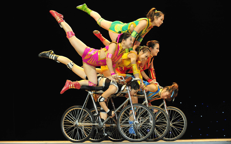 Chinese acrobats perform on bicycles in a theater in celebration of the Mid-Autumn Festival in Shenyang, Liaoning Province in China. (EPA)