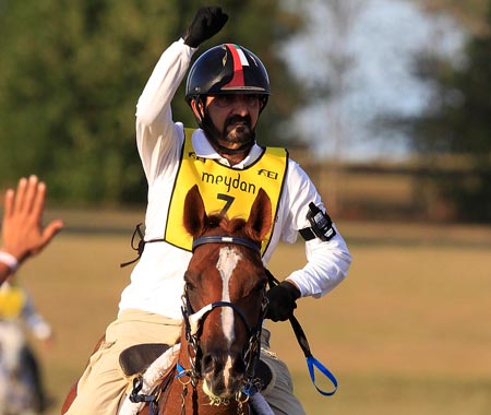 Sheikh Mohammed bin Rashid Al Maktoum of the United Arab Emirates riding Ciel Oriental celebrates as he crosses the finish line to finish second in the World Endurance Championship at the World Equestrian Games in Lexington, Kentucky. (REUTERS)