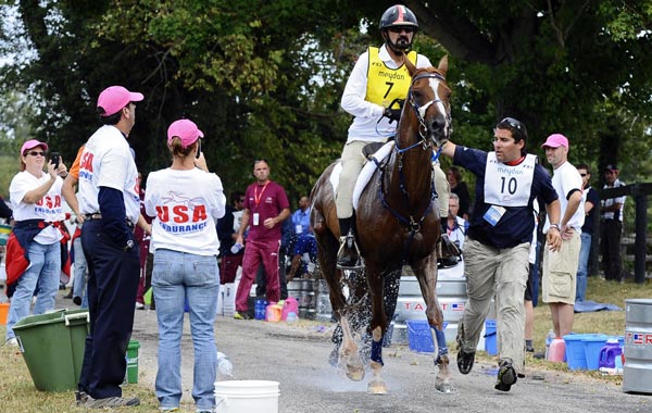 Ciel Oriental ridden by HH Sh Mohammed bin Rashid AL Maktoum from United Arab Emirates gets watered down at a watering area during the Endurance Championship during the World Equestrian Games in Lexington, Kentucky. (EPA)