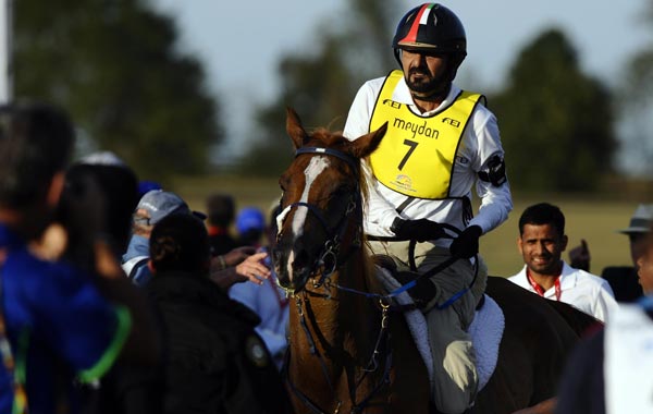 Ciel Oriental ridden by HH Sh Mohammed bin Rashid AL Maktoum from United Arab Emirates crosses the finish line in second place in the Endurance Championship during the World Equestrian Games in Lexington, Kentucky. (EPA)