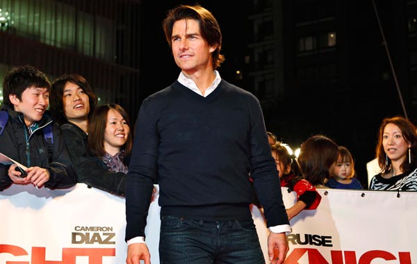 US actor Tom Cruise poses for photographs at the premiere of the movie 'Knight and Day' at the Roppongi Hills Arena in Tokyo, Japan. (EPA)