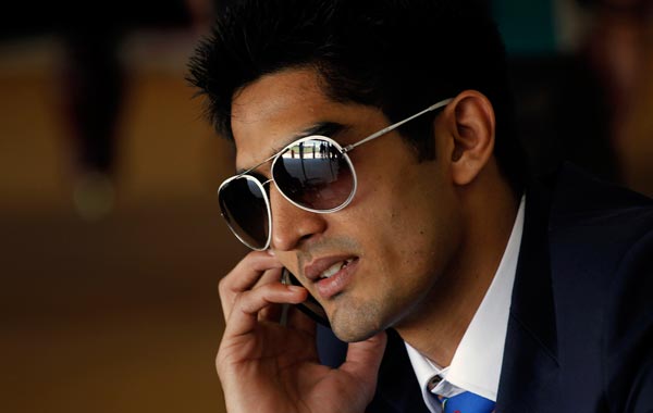 Indian boxer Vijender Singh, who won bronze at the Beijing Olympics, speaks on his phone at the Commonwealth Games athletes' village in New Delhi, India. (AP)