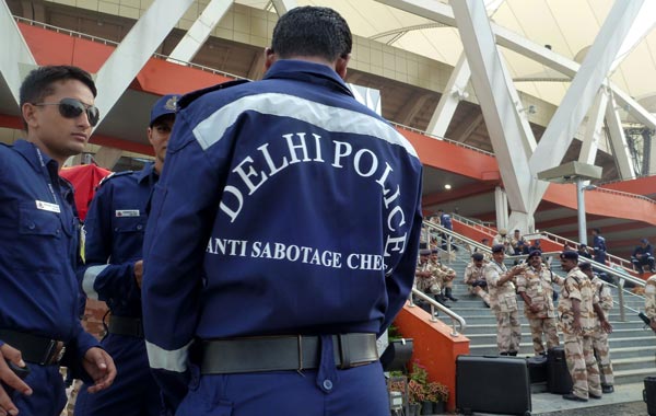 Members of the Indian anti-bomb squad take a break as a security check is organised at Jawaharlal Nehru stadium in New Delhi. (AFP)