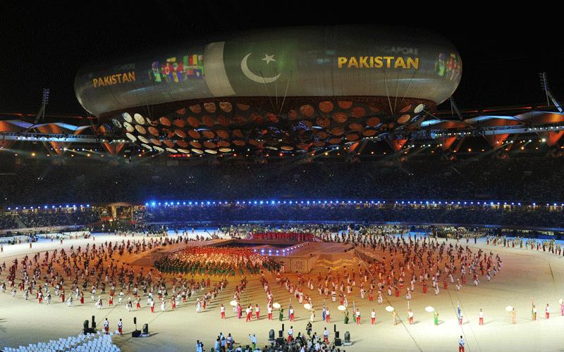 Pakistan's national flag is projected onto the aerostat as athletes arrive onto the field of the XIX Commonwealth Games opening ceremony at the Jawaharlal Nehru Stadium in New Delhi. (AFP)