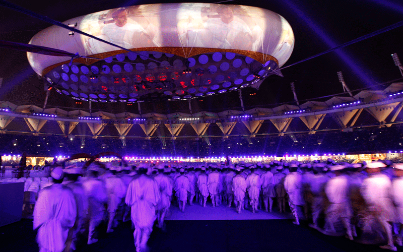 Performers walk onto the stage during the opening ceremony for the 19th Commonwealth Games at the Jawaharlal Nehru stadium in New Delhi. (AP)