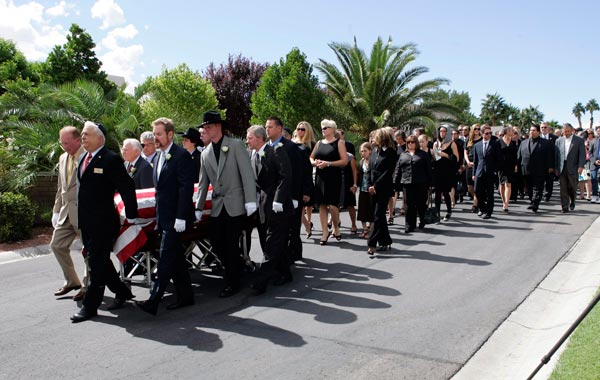 Pallbearers bring the casket to a burial site during the funeral for actor Tony Curtis at Palm Mortuary and Cemetery in Henderson, Nevada. (REUTERS)