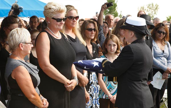Wife Jill Vandenberg (2-L) and family pay their final respects at services for her husband, American film actor Tony Curtis during his memorial at Palm Mortuary in Las Vegas, USA. (EPA)