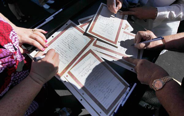 Mourners sign the registry at the funeral for actor Tony Curtis. (AP)