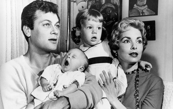 Tony Curtis and Janet Leigh are shown with their daughters Kelly, 2 1/2, and newborn Jamie Lee in Hollywood, Ca., in this Jan. 16, 1959 file photo. (AP)