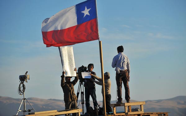 Journalists work in the surroundings of the San Jose mine, in the arid Atacama desert, 800 km (480 miles) north of Santiago. (AFP)