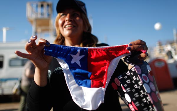 Antonia Godoy, mother of trapped miner Richard Villarroel, shows Chilean flag underwear she received as a gift for his son when he is rescued, at a camp near the San Jose mine near Copiapo, Chile. (AP)