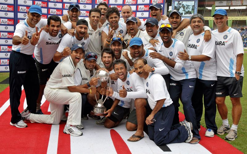 Members of the Indian cricket team and their support staff pose with the Border Gavaskar trophy after winning the test series against Australia in Bangalore, India. (AP)