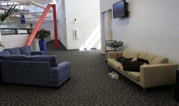 An employee takes a nap in one of many common areas at the Google headquarters in Mountain View. (REUTERS)