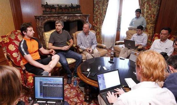 Google co-founder Sergey Brin talks to reporters, as co-founder Larry Page and Chairman and Chief Executive Eric Schmidt listen, at the Sun Valley Inn in Idaho. (REUTERS)