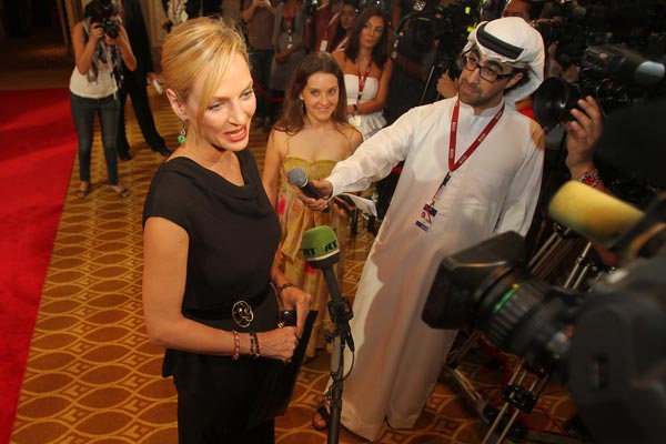 US actress Uma Thurman speaks to the press on the red carpet upon her arrival to attend the closing ceremony of the Abu Dhabi International Film Festival in the Emirati capital. (AFP)