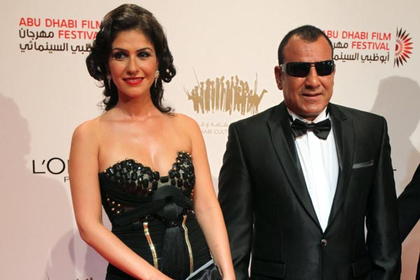 Egyptian actor Mahmoud Lotfy (R) and actress Basma arrive to attend the award ceremony of the Abu Dhabi Film Festival in Abu Dhabi, United Arab Emirates. (EPA)