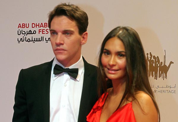 Irish actor Jonathan Rhys Meyers poses on the red carpet with his girlfriend Reena Hammer upon their arrival to attend the closing ceremony of the Abu Dhabi International Film Festival in the Emirati capital. (AFP)