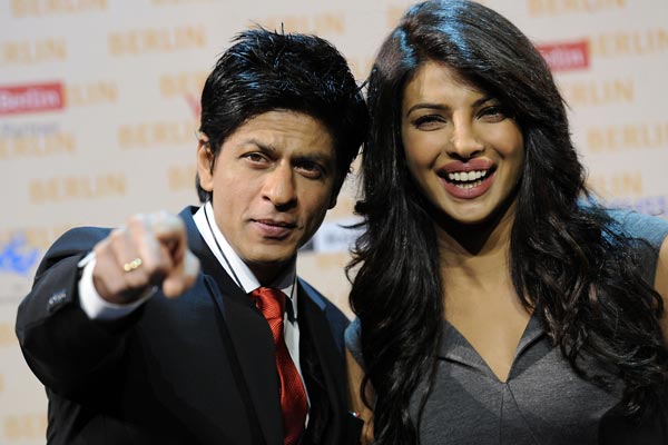Bollywood actor Shah Rukh Khan and  co-star actress Priyanka Chopra, right, pose during a photo call in Berlin, Germany. (AP)