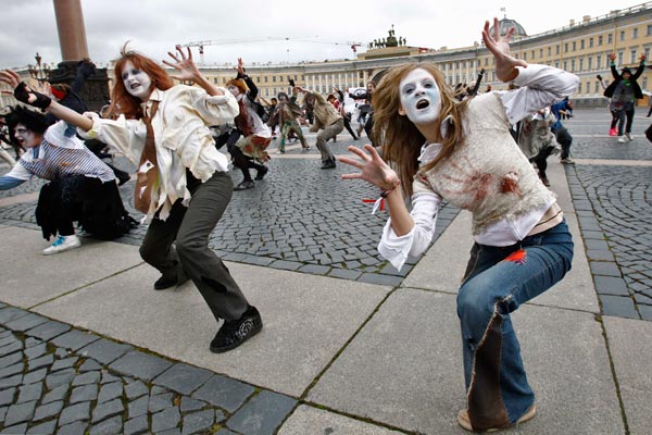 Russian fans of Michael Jackson disguised as zombies perform his song "Thriller" at Dvortsovaya (Palace) Square in St.Petersburg, Russia. (AP)