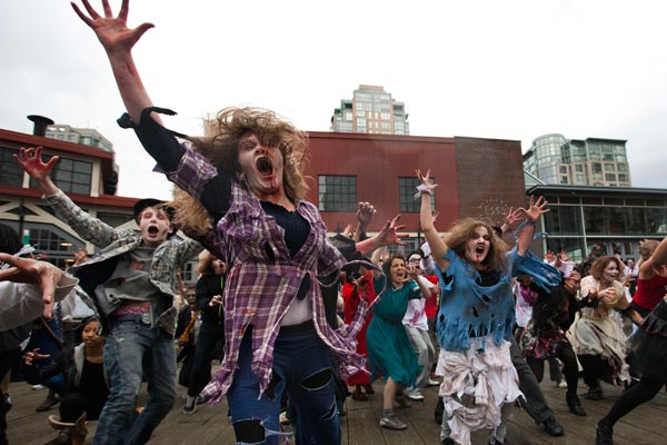 People dressed as Zombies dance to Michael Jackson's "Thriller" in downtown Vancouver, British Columbia. (REUTERS)