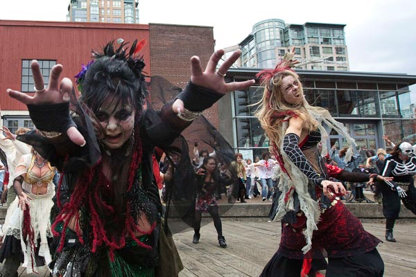 People dressed as zombies dance to Michael Jackson's "Thriller" in downtown Vancouver, British Columbia. (REUTERS)