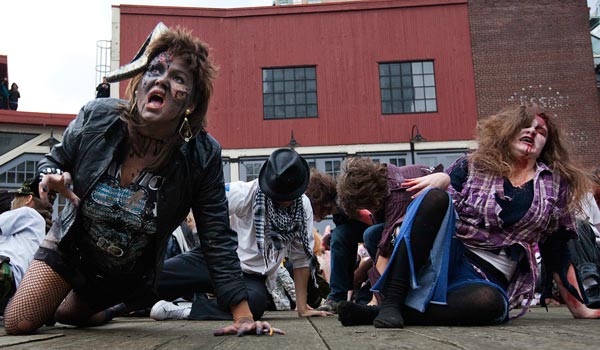 People dressed as zombies dance to Michael Jackson's "Thriller" in downtown Vancouver, British Columbia. (REUTERS)