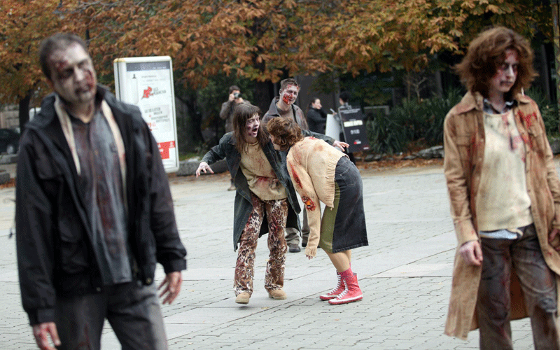 Actor dressed as zombies walk through the streets of Sofia, Bulgaria, 26 October 2010. The show was part of the promotion for the US television series The Walking Dead. (EPA)
