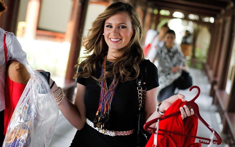 Miss El Salvador, Maria Gabriela Molina Rochac carries her dresses before a dress rehearsal for the Miss World 2010 pageant in Sanya, China's Hainan province. The 60th Miss World pageant final will take place on Saturday. (EPA)