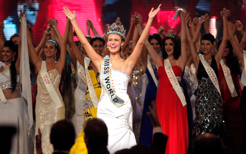 Miss USA Alexandria Mills, front center, gestures with other contestants after being crowned the winner of the 2010 Miss World pageant contest at the Beauty Crown Cultural Center in Sanya, in southern China's island province Hainan. (AP)