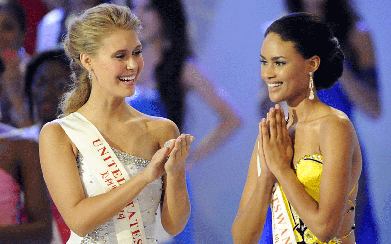 Miss Botswana Emma Wareus (R) smiles next to Miss United States as she is announced as the runner-up during the Miss World 2010 Beauty Pageant finals at the Beauty Crown Theatre in the southern Chinese resort town of Sanya. (AFP)