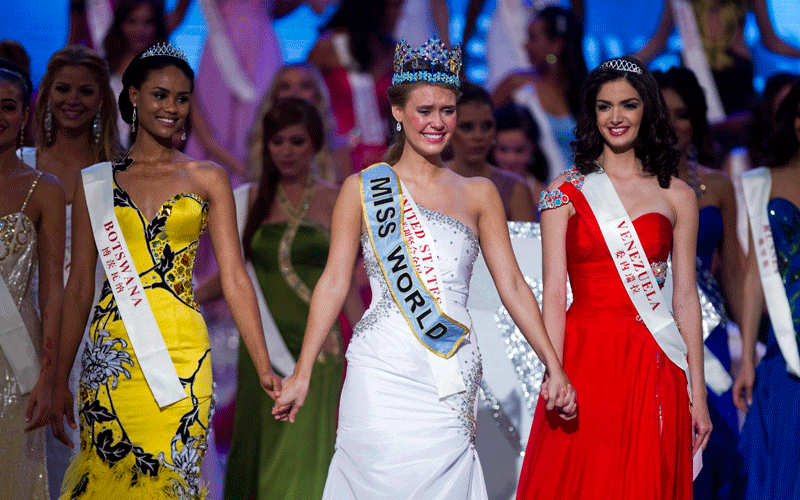 Alexandria Mills (C) of the USA is crowned the new Miss World during the live final for the 60th Miss World in Sanya, China's Hainan province, on Saturday. Runners up were Miss Botswana, Emma Wareus (L) and Miss Venezuela, Adriana Vasini (R). (EPA)
