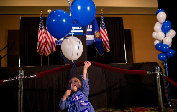 Elijah Rutten (2) plays with balloons in front of the stage for Democratic candidate for Wisconsin Russ Feingold during the beginning of the election night party in the midterm elections. (AFP)
