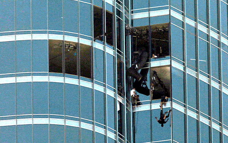 High-rise stunts in Dubai as actor Tom Cruise and his crew hang on harnesses from the top of the world’s tallest building, the Burj Khalifa, on Wednesday, November 3 (PATRICK CASTILLO)