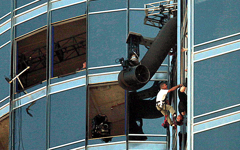 Zooming in for the details: Crew set up a shot as Tom Cruise dangles upside down from the the world’s tallest building, the Burj Khalifa, on Wednesday, November 3 (PATRICK CASTILLO)