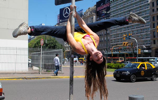 A dancer performs a pole dancing routine to promote the Miss Pole Dancing Southamerica 2010 competition in Buenos Aires. (REUTERS)
