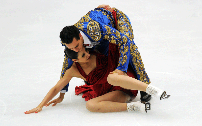 Federica Faiella and Massimo Scali of Italy fall as they perform their pair's ice dance free dance programme during the ISU Grand Prix of Figure Skating 2010/2011 in Beijing on Saturday. (AFP)