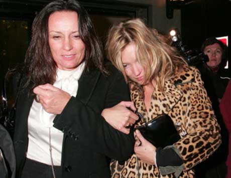 Supermodel Kate Moss, right, pictured leaving The Club at The Ivy, where she is a regular visitor. (FILE)